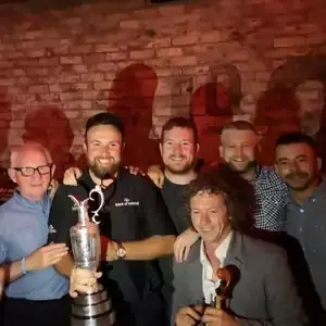 George Murphy and friends with a trophy